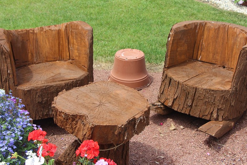 Tree Stump Chairs At Ebert's Greenhouse Village In Ixonia, Wis.