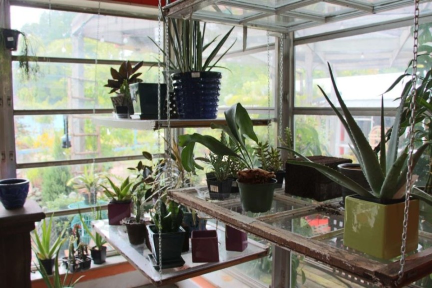 Build a vertical shelf with reclaimed window shelves