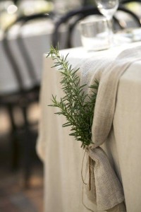 An herb bundle hung behind chair or on a table runner adds a rustic touch.