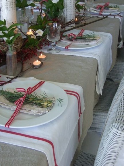 A simple rosemary sprig in a place setting.