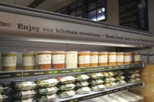 Product cabinet with positioning signage at Lepp Farm Market