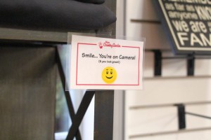 Security camera sign at Minter Country Garden