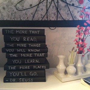 Books wrapped in chalkboard paint book covers.