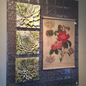 Botanical wall art layered with tin tiles.