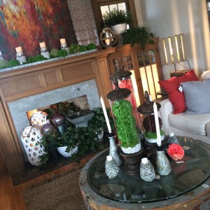 Gazing globes, greenery and a fountain fill the fireplace.