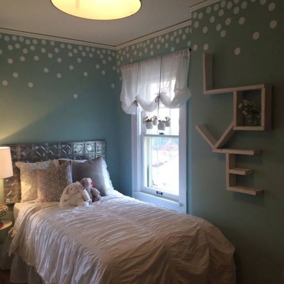 The girls' bedroom includes a playful paint treatment.