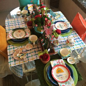 Porch table setting with faux turf as a table runner. 