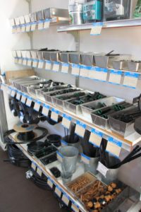 Bread baking pans hold drip irrigation components at Garden Fever