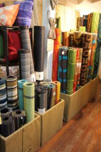 Burlap wrapped bins for rugs at Garden Fever