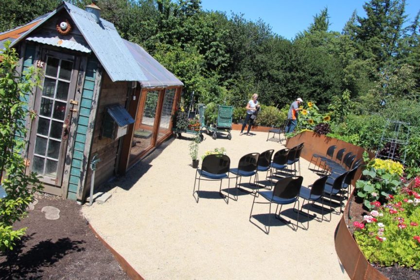 Cornell Farms built an attractive chicken coop, and set up an outdoor classroom along side it.