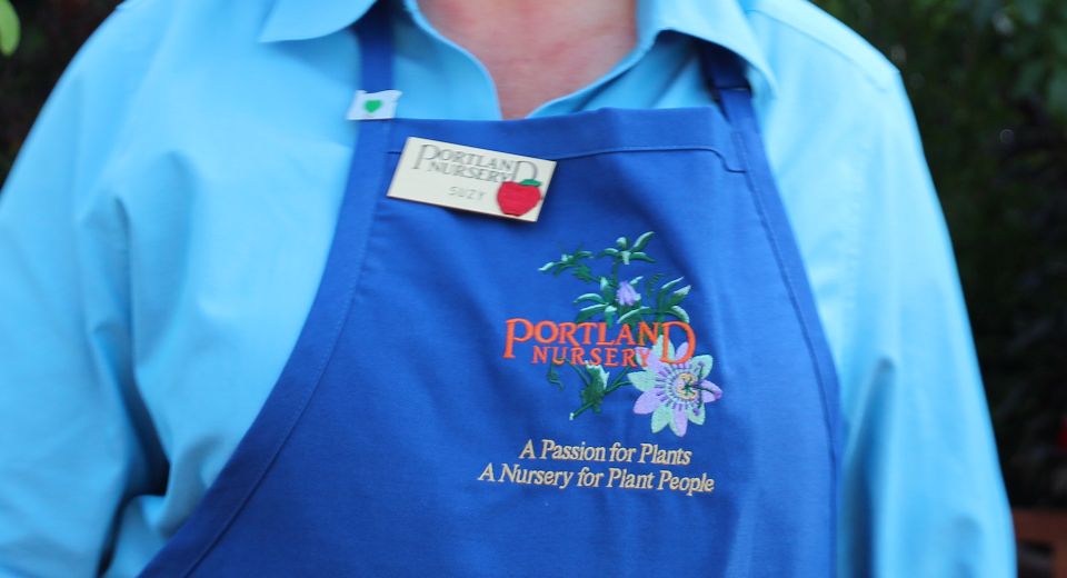 Portland Nursery's tag line on employee's' work aprons burnishes its image.
