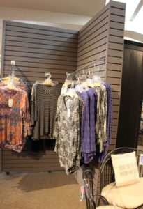 This wood slat wall unit at Al's Garden Center has wheels and can be easily moved