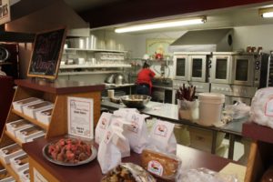 A kitchen view from the bakery counter